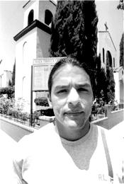 Ex-altar boy and abuse victim Lorenzo Najera at L.A.&#39;s Santa Teresita Parish Church. Photo by Gary Leonard. - 2002_08_15_Russell_CampPed_Lorenzo_Najera