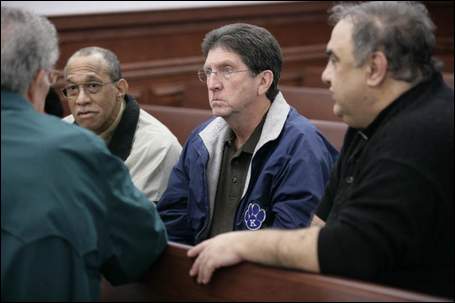 After the sentencing, John C. Scott, Bernie Queenan, Rev. Gary Hayes listened to Vince Grenough
