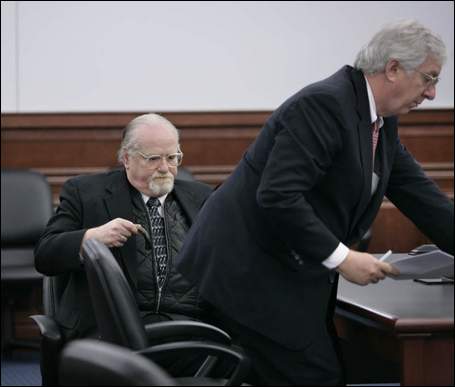Clark prepared to leave the courtroom
