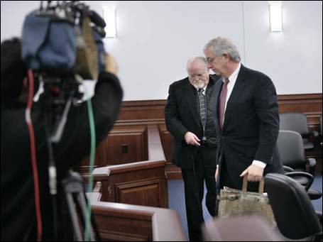 Clark left with his attorney David Lamberstus, at right, after his sentencing.