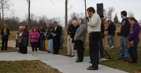 Finn supporters pray the rosary during the meeting yesterday