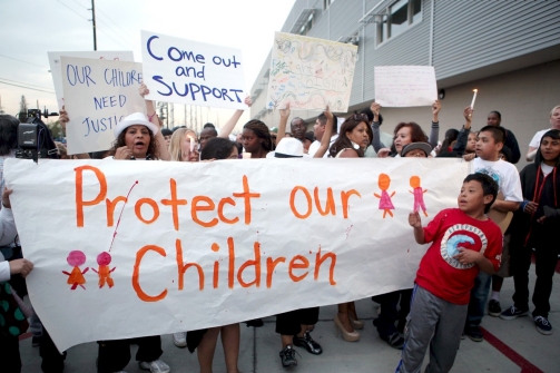 Protesters near Miramonte Elementary School in Los Angeles on Monday, Krista Kennell, AFP / Getty Images
