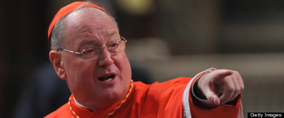 US cardinal Timothy Michael Dolan gestures prior to the mass led by Pope Benedict XVI with new Cardinals in St. Peter's basilica at the Vatican on February 19, 2012. The Pontiff put his stamp of authority on the body that will elect his successor as he appointed 22 new cardinals at a time of roiling tensions in the Vatican administration. AFP PHOTO / ALBERTO PIZZOLI