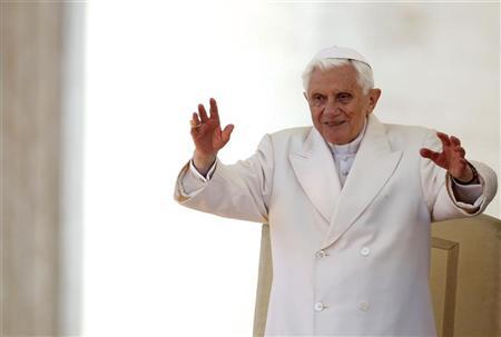 Pope Benedict XVI waves during his Wednesday general audience in Saint Peter's Square at the Vatican March 14, 2012.