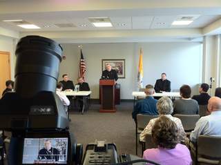 Father Gregory Parks speaks at a press conference.