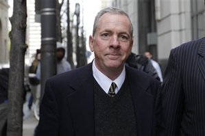 The Rev. James J. Brennan exits the Criminal Justice Center, Monday, March 26, 2012, in Philadelphia. Brennan is charged with the attempted rape of a 14-year-old boy in the 1990s. (AP Photo/Matt Rourke)