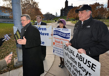 Road to Recovery founder Robert Hoatson (far left) protested on the edge of the Syracuse University campus in mid-November amid allegations of sexual abuse against assistant basketball coach Bernie Fine. Hoatson said the protest was in support of the two men who originally accused Fine of molesting them, former ballboys and stepbrothers Bobby Davis and Mike Lang. Hoatson has repeatedly called for the university to fire head coach Jim Boeheim and Nancy Cantor for the allegations Hoatson has said occurred on their watches. With Hoatson are (from left to right) Richard Tollner, Marianne Barone Trent and Dick Regan.