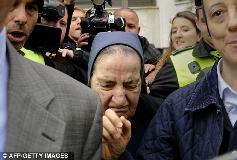 Media scrum: Spanish nun Maria Gomez Valbuena was surrounded by journalists and broadcasters following her appearance at court in Madrid today