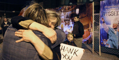 Maureen Bihn hugs a parishioner of St. Casimir Catholic Church on East 82nd Street and Sowinski Avenue Wednesday, March 7, 2012, after arriving at a vigil in front of the church. Church members heard the news they won the appeal to keep the church open in Cleveland. The locks may be removed soon and the church doors opened as St. Casimir -- along with 12 other closed Catholic churches in the diocese -- won their appeal to stay open.