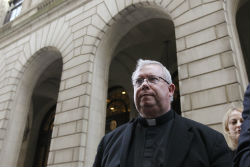 The embattled Monsignor Lynn leaves a Philadelphia courthouse.