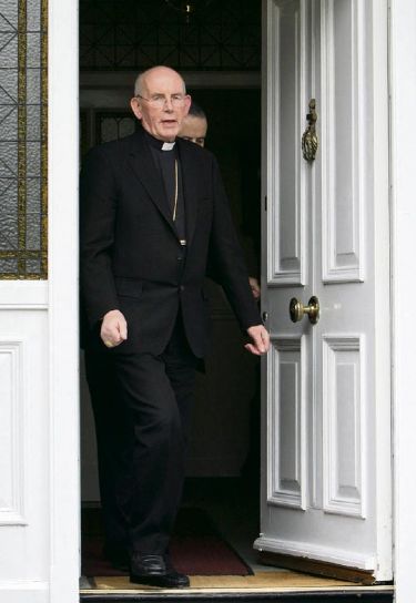 Under siege: Cardinal Brady faces the media last week PA