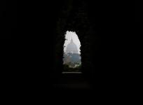 The St. Peter's Basilica dome is seen through the spy hole of Knights of Malta gardens in Rome, Monday, May 28, 2012. The Vatican's investigation into the source of leaked documents has yielded its first target with the arrest of the pope's butler, but the investigation is continuing into a scandal that has embarrassed the Holy See by revealing evidence of internal power struggles, intrigue and corruption in the highest levels of the Catholic Church governance. (AP Photo/Gregorio Borgia)