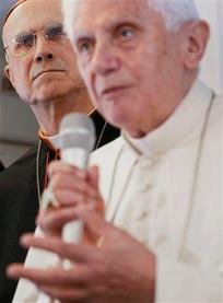 FILE - In this March 23, 2012 file photo, Vatican Secretary of State Tarcisio Bertone, left, looks on as Pope Benedict XVI talks to journalists during a press conference aboard the flight to Silao, Mexico. An already sordid scandal over leaked Vatican documents took a Hollywood-like turn Saturday, May 26, 2012 with confirmation that the pope's own butler had been arrested after documents he had no business having were found in his Vatican City apartment. The "Vatileaks" scandal has seriously embarrassed the Vatican at a time when it is trying to show the world financial community that it has turned a page and shed its reputation as a scandal plagued tax haven. Bertone, 77, has been blamed for a series of gaffes and management problems that have plagued Benedict's papacy and, according to the leaked documents, generated a not inconsiderable amount of ill will directed at him from other Vatican officials. (AP Photo/Gregorio Borgia, File)