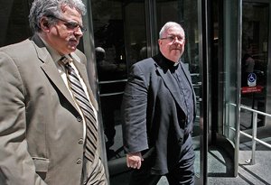 Msgr. William Lynn (right) leaves the Criminal Justice Center in Philadelphia on Thursday, June 14, 2012. ( ALEJANDRO A. ALVAREZ / STAFF PHOTOGRAPHER )