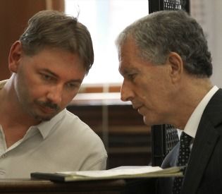 Andrzej J. Urbaniak, left, listens to his lawyer Jeffrey Denner yesterday during his arraignment.