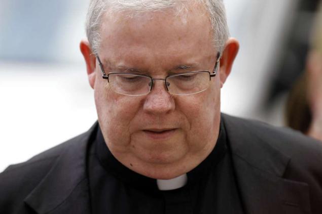 Monsignor William Lynn walks to the Criminal Justice Center before a scheduled verdict reading, Friday, June 22, 2012, in Philadelphia. Lynn was convicted of child endangerment but acquitted of conspiracy in a groundbreaking clergy-abuse trial, becoming the first U.S. church official convicted of a crime for mishandling abuse claims. The jury could not agree on a verdict for Lynn's co-defendant, the Rev. James Brennan, who was accused of sexually abusing a 14-year-old boy. (AP Photo/Matt Rourke)