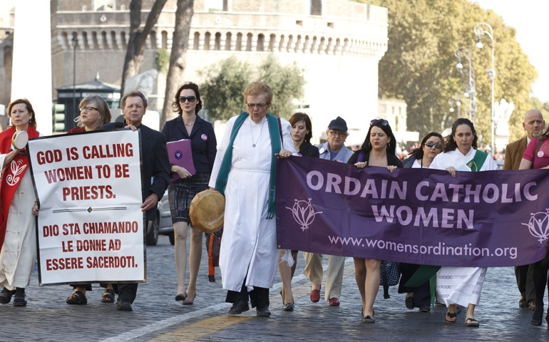 Roy Bourgeois, third from left, marches down Via della Conciliazione toward the Vatican during a demonstration in Rome Oct. 17, 2011. (CNS/Paul Haring)
