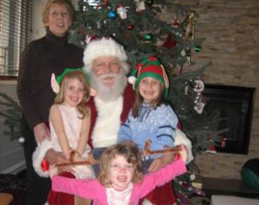 Madonna Badger's father Lomer Johnson as "Happy Santa" with wife Pauline and the Badger children; Lily in the blue, Grace at the bottom and Sarah in the white.