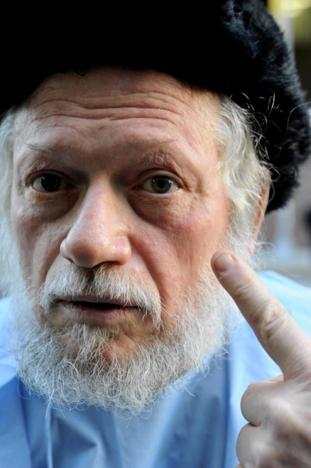 Nuchem Rosenberg speaks outside Woodhull Hospital Tuesday, Dec. 11, 2012 after being treated for what was apparently bleach thrown in his face earlier that afternoon.