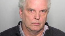 Montreal deacon William Kokesch has been accused of producing and distributing child pornography a day after police say they seized 2,000 images from his home. (Service de police de la Ville de Montreal / THE CANADIAN PRESS)