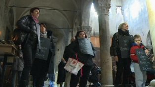 Women with placards in the church