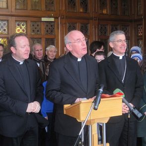 Cardinal Sean Brady (centre) announces his retirement
