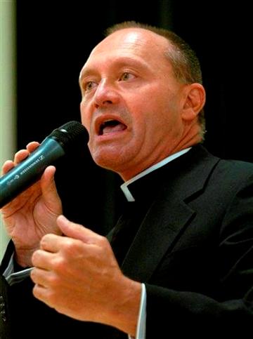 In this May 4, 2006 photo, Monsignor Kevin Wallin speaks at the Catholic Center, headquarters of the Diocese of Bridgeport, in Bridgeport, Conn.