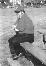 Brother Stephen Baker sits on a bench during his time at Bishop McCort High School.