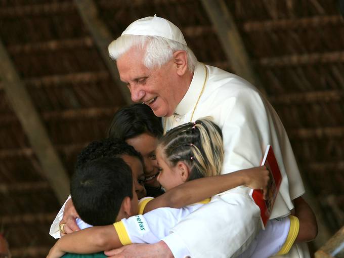 Pope Benedict XVI embraces children during a visit at the Fazenda da Esperanca, a facility for recovering drug addicts, on May 12, 2007, in Guaratingueta, Brazil. Franco Origlia, Getty Images