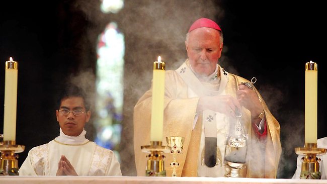 Melbourne Archbishop Denis Hart, seen presiding over an Easter Sunday Mass, has paid tribute to the outgoing Pope. Picture: Matthew Bouwmeester