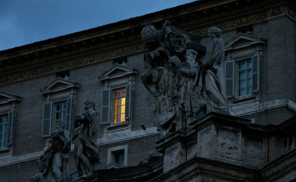 Early Tuesday, lights were on in Pope Benedict XVI’s apartment overlooking St. Peter’s Square.