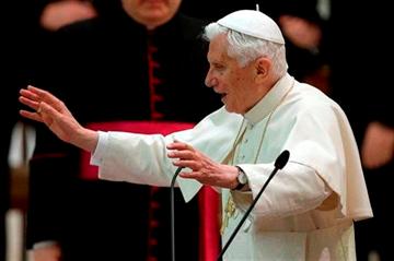 (AP Photo/Alessandra Tarantino). Pope Benedict XVI delivers his blessing after an audience with the Roman clergy in the Paul VI Hall at the Vatican, Thursday Feb. 14, 2013.