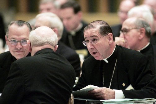 Cardinal Roger Mahoney, right, speaks with other church leaders at a conference in Chicago, Illinois in 2005. (Scott Olson/Getty)