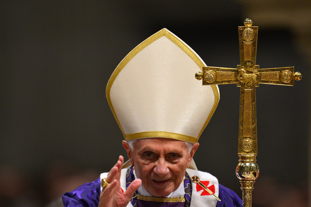 Pope Benedict XVI leaves Ash Wednesday mass on Feb. 13, 2013. Photographer: Gabriel Bouys/AFP via Getty Images