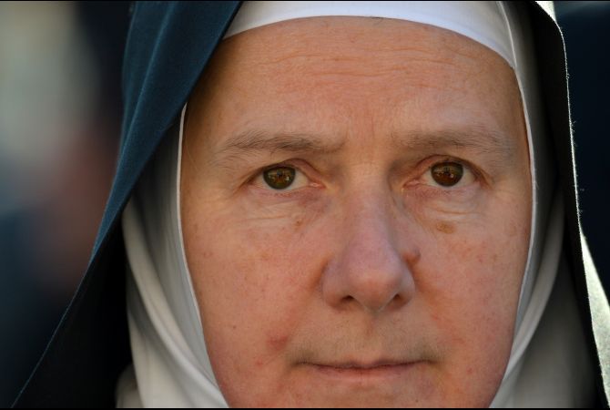 A nun takes a place on St. Peter's Square ahead of Pope Benedict XVI's last weekly audience on February 27, 2013 at the Vatican, on the eve of Benedict's historic resignation as leader of the world's 1.2 billion Catholics. (Gabriel Bouys/AFP/Getty Images)