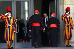 (Franco Origlia/Getty Images) - The Archbishop of New York, cardinal Timothy Dolan and the former Archbishop of Philadelphia, Cardinal Justin Rigali, arrive at the Paul VI hall for the opening of the Cardinals’ Congregations on March 4, 2013 in Vatican City, Vatican.