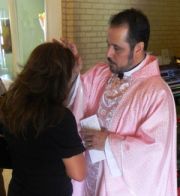 Photo: Father Martinez at Holy Family Catholic Church