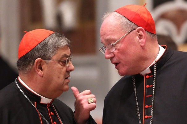 Archbishop of New York cardinal Timothy Dolan (R) chats with Italian cardinal Crescenzio Sepe (L) during a meeting of prayer at St. Peter's Basilica with cardinals gathered in Rome for the conlave on March 6, 2013 in Vatican City, Vatican.