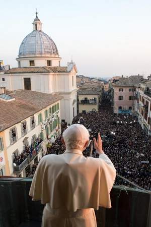 This handout picture released by the Vatican Press Office and taken on February 28, 2013 shows Pope Benedict XVI blessing faithful from the balcony of his new temporary residence of Castel Gandolfo near Rome, a few hours before he officially resigned. Benedict XVI has become the first pope to resign in over 700 years, telling a tearful crowd of faithful that he will now be 'a simple pilgrim' as cardinals on Friday begin preparing for a conclave in the Sistine Chapel to elect his successor. AFP PHOTO/OSSERVATORE ROMANO RESTRICTED TO EDITORIAL USE - MANDATORY CREDIT 'AFP PHOTO/OSSERVATORE ROMANO'-/AFP/Getty Images / AFP/Getty Images
