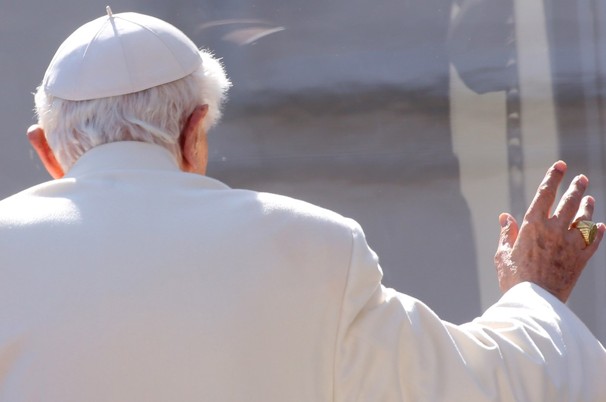 Pope Benedict XVI waves to the faithful as he leaves St Peter's Square at the end of his final general audience on February 27, 2013 in Vatican City, Vatican.