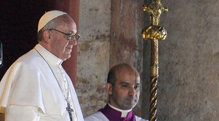 Argentinian cardinal Jorge Mario Bergoglio, left, appears at the window of St. Peter's Basilica's balcony after being elected the 266th pope of the Roman Catholic Church