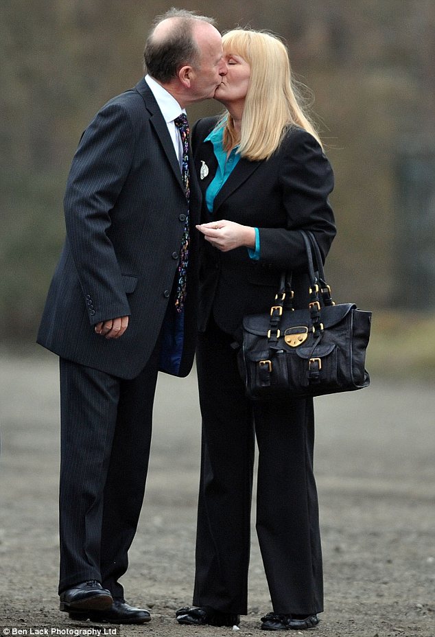 Embrace: The couple kissed in front of photographers as they arrived at Bradford Crown Court