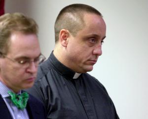 The Rev. Michael Fugee, right, in this file photo from 2001.