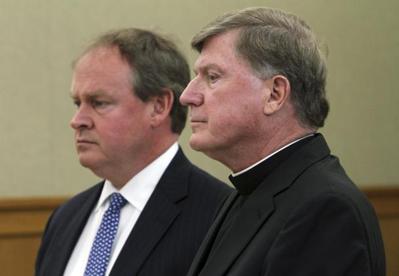 Bishop Robert McManus stood in court today with his attorney, William Murphy. (Frieda Squires/Providence Journal/AP/Pool)