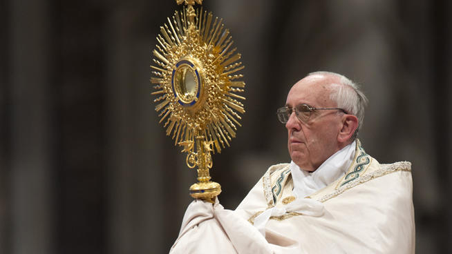 Pope Francis celebrates a worldwide Eucharistic adoration ceremony in St. Peter's Basilica, at the Vatican, Sunday, June 2, 2013. Pope Francis is appealing to the "humanity" of kidnappers in Syria to release hostages. Francis urged prayers for "beloved Syria" as he spoke from his studio window overlooking St. Peter's Square on Sunday to a crowd below. He lamented that the war there has stricken a defenseless people aspiring to peace. (AP Photo/Andrew Medichini)