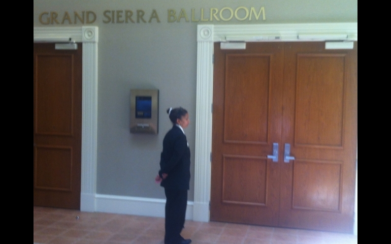 A guard prevents access to Seattle Archbishop J. Peter Sartain's address to the Leadership Conference of Women Religious in Orlando Aug. 15. (NCR photo/ Thomas C. Fox)