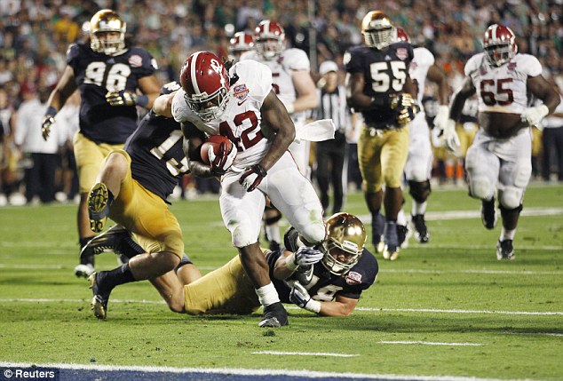 No punishment: The still unnamed player involved did not miss a single game, and even played in January's National Championship for Notre Dame's Fighting Irish football team (in blue and gold)