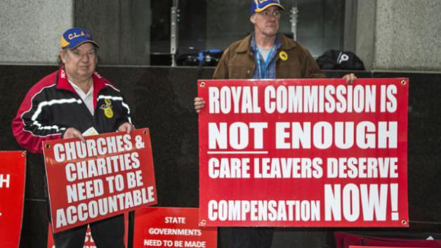 Protestors outside the Sydney hearings (Image source: