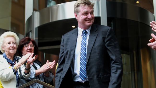 Whistleblower Armand Hoitink is clapped by supporters as he leaves the inquiry yesterday. Source: News Limited