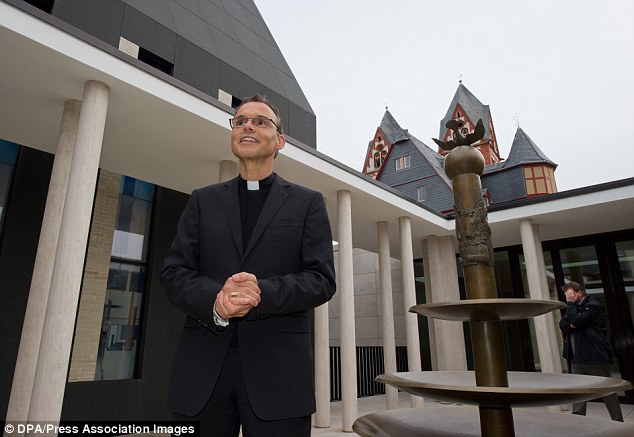 Under pressure: Franz-Peter Tebart, Bishop of Limburg, above in the courtyard of the controversial residence, is facing calls to resign after it emerged the building will cost more than six times its original value